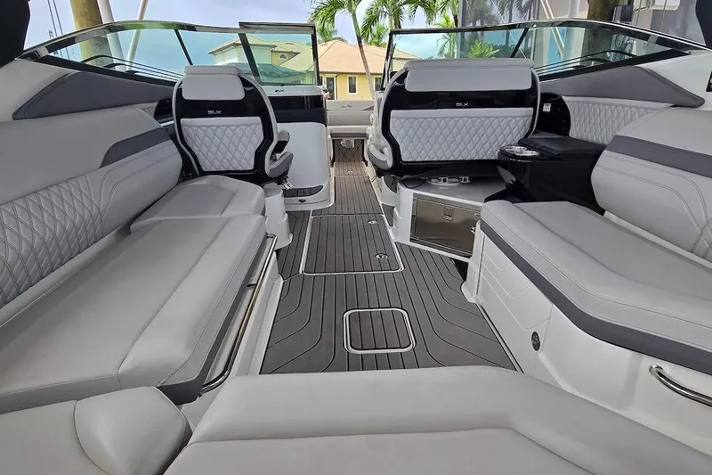 Slide: The Image of 2023 Sea Ray SLX 280 Outboard interior with luxurious seating and modern design. - 2