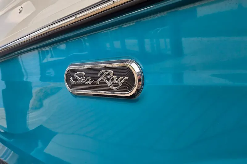 Slide: The Image of 2023 Sea Ray SLX 280 Outboard logo on blue boat exterior. - 25