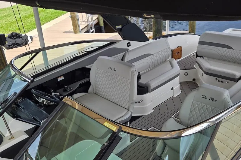 Slide: The Image of 2023 Sea Ray SLX 280 Outboard boat interior with luxurious seating and modern design. - 26