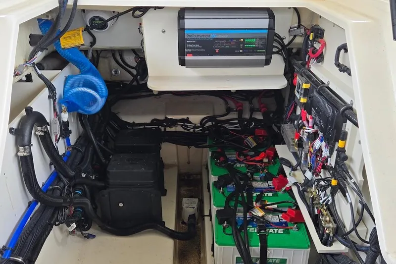 Slide: The Image of 2023 Sea Ray SLX 280 Outboard electrical system with batteries and wiring. - 29