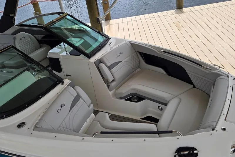Slide: The Image of 2023 Sea Ray SLX 280 Outboard boat interior with luxurious seating and modern design. - 8