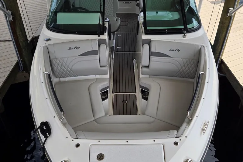 Slide: The Image of 2023 Sea Ray SLX 280 Outboard boat interior with luxurious seating and sleek design. - 9