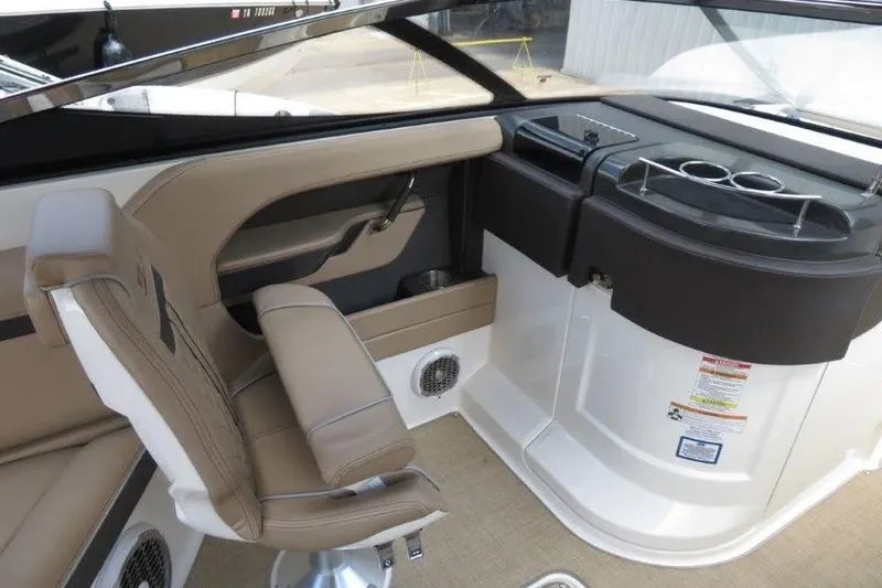 Slide: The Image of Interior of 2016 Sea Ray 280 SLX boat with beige seating and dashboard. - 6
