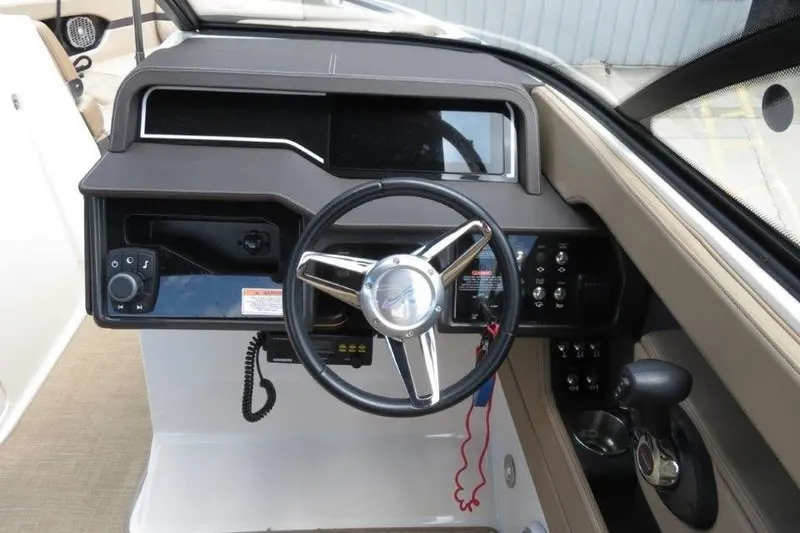 Slide: The Image of 2016 Sea Ray 280 SLX boat dashboard with steering wheel and control panel. - 7
