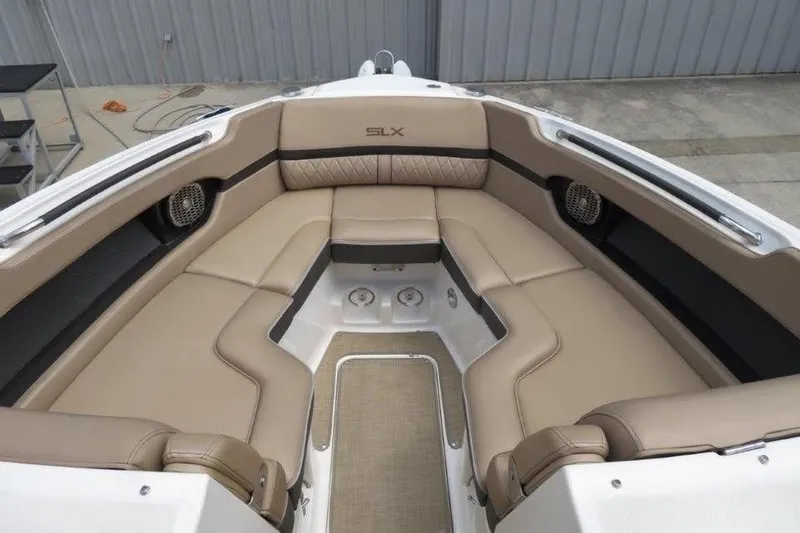 Slide: The Image of Luxurious seating area on a 2016 Sea Ray 280 SLX boat with beige upholstery. - 9