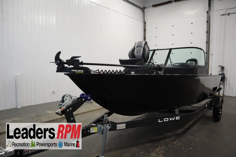 The Image of 2026 Lowe Fishing Machine 175 boat on trailer in indoor showroom. - 0