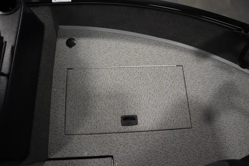 Slide: The Image of 2026 Lowe Fishing Machine 175 boat interior with storage compartment. - 16