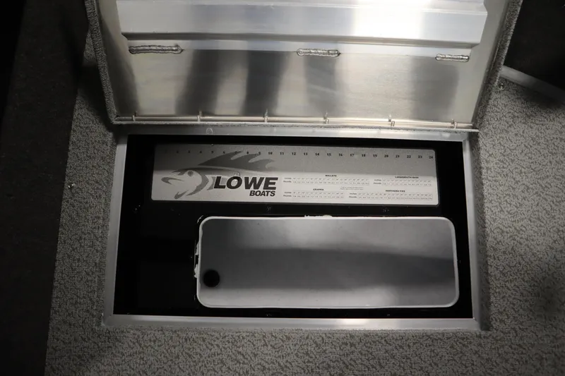 Slide: The Image of 2026 Lowe Fishing Machine 175 storage compartment with integrated fish ruler. - 17