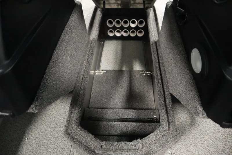 Slide: The Image of 2026 Lowe Fishing Machine 175 interior storage compartment with rod holders. - 21