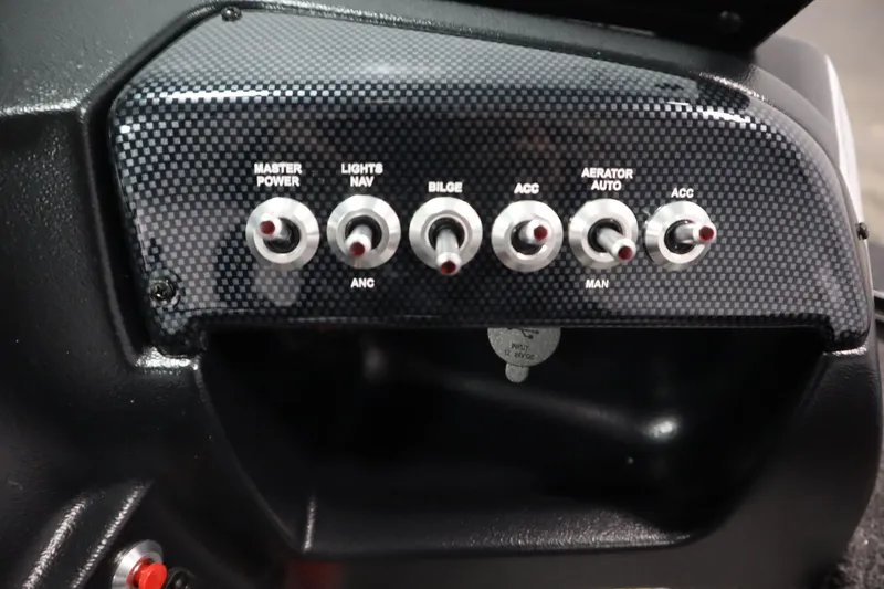 Slide: The Image of Control panel of 2026 Lowe Fishing Machine 175 with multiple switches. - 29