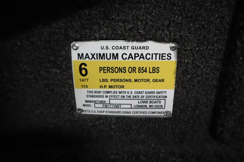 Slide: The Image of 2026 Lowe Fishing Machine 175 capacity label, 6 persons or 854 lbs, U.S. Coast Guard compliant. - 30