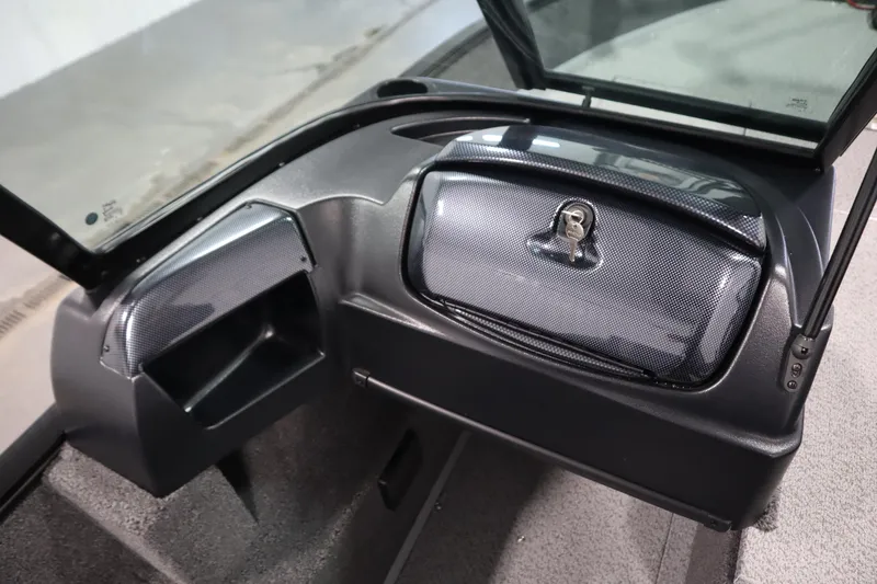 Slide: The Image of 2026 Lowe Fishing Machine 175 dashboard with storage compartment and windshield. - 32