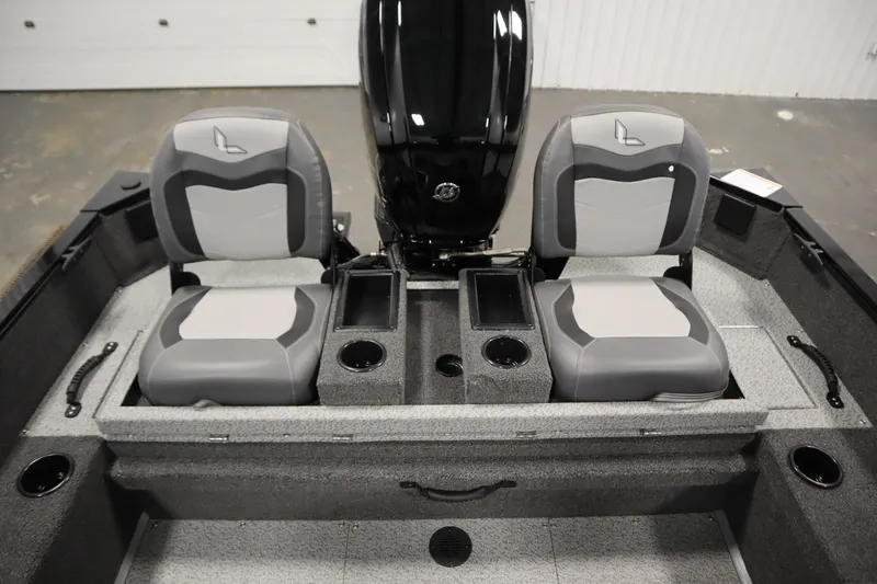 Slide: The Image of 2026 Lowe Fishing Machine 175 interior with dual seats and storage compartments. - 36