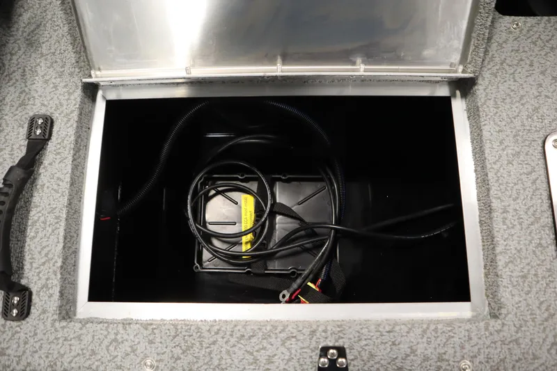 Slide: The Image of 2026 Lowe Fishing Machine 175 storage compartment with wiring and cables. - 39