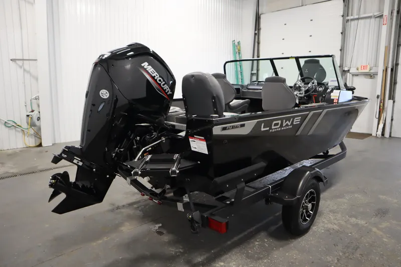 Slide: The Image of 2026 Lowe Fishing Machine 175 boat with Mercury engine in a garage setting. - 4