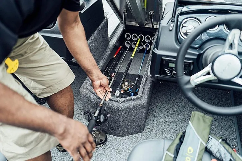 Slide: The Image of 2026 Lowe Fishing Machine 175 interior with fishing rod storage compartment. - 58