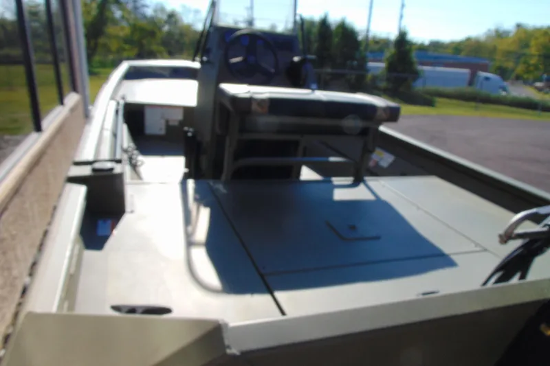 Slide: The Image of 2026 Crestliner 1860 Retriever CC boat interior with steering console and seating. - 5