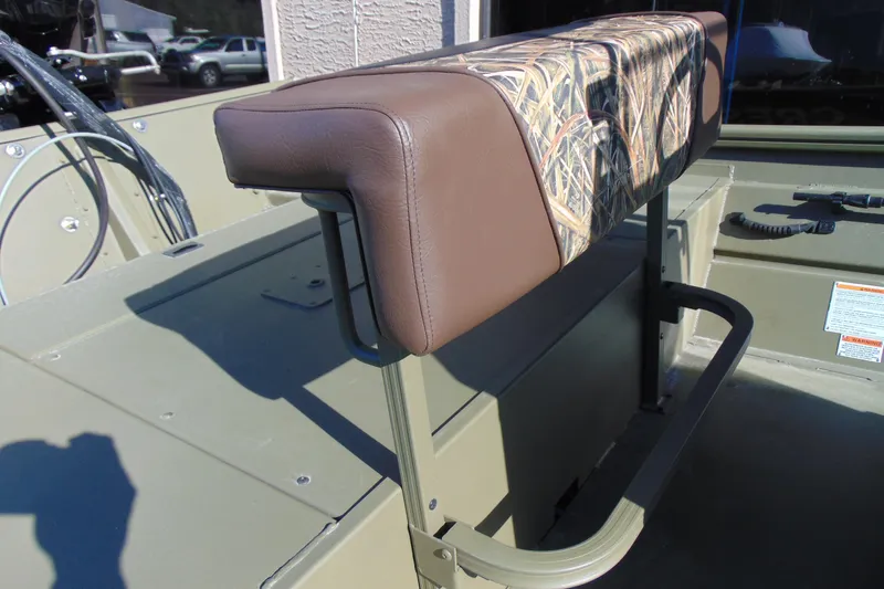 Slide: The Image of 2026 Crestliner 1860 Retriever CC boat seat with camouflage and brown upholstery. - 8