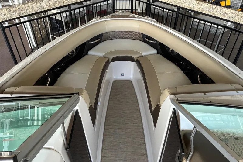 Slide: The Image of 2014 Regal 2500 Bowrider interior with beige seating and modern design. - 7