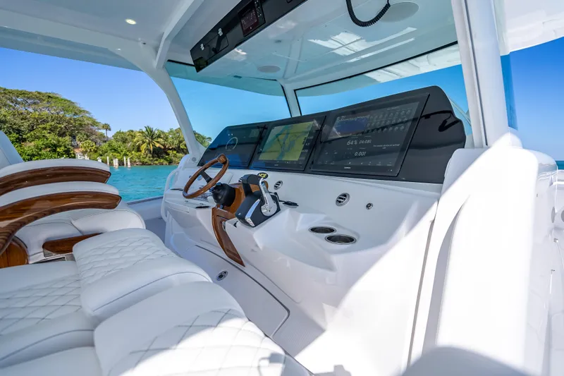 Slide: The Image of 2026 HCB 65 Estrella luxury yacht cockpit with advanced navigation displays. - 16