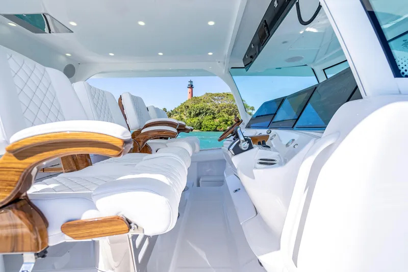 Slide: The Image of Interior of 2026 HCB 65 Estrella yacht with luxurious seating and modern dashboard. - 17