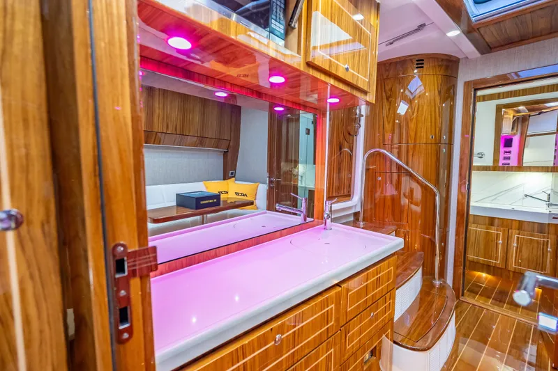 Slide: The Image of Luxurious interior of 2026 HCB 65 Estrella yacht with wood finish and modern lighting. - 25