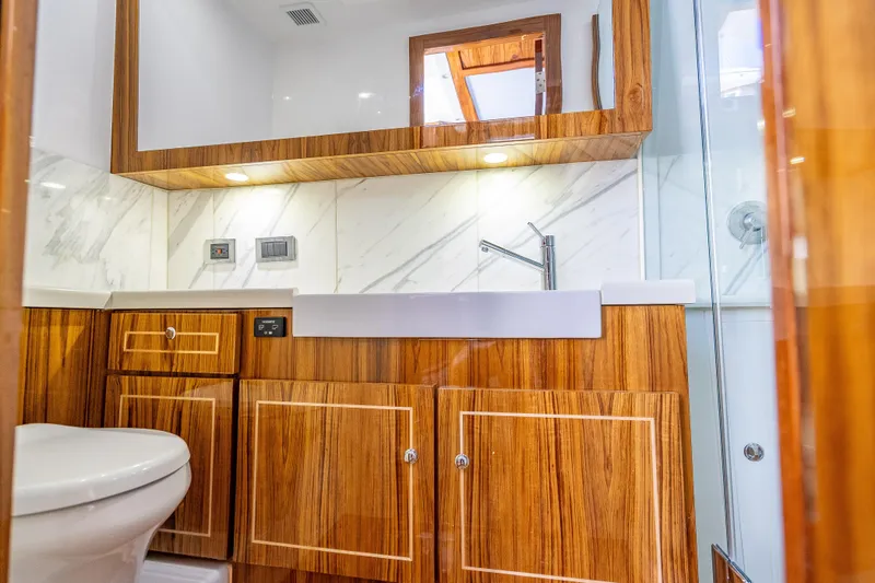 Slide: The Image of Luxurious bathroom interior of 2026 HCB 65 Estrella yacht with wood accents and modern fixtures. - 31