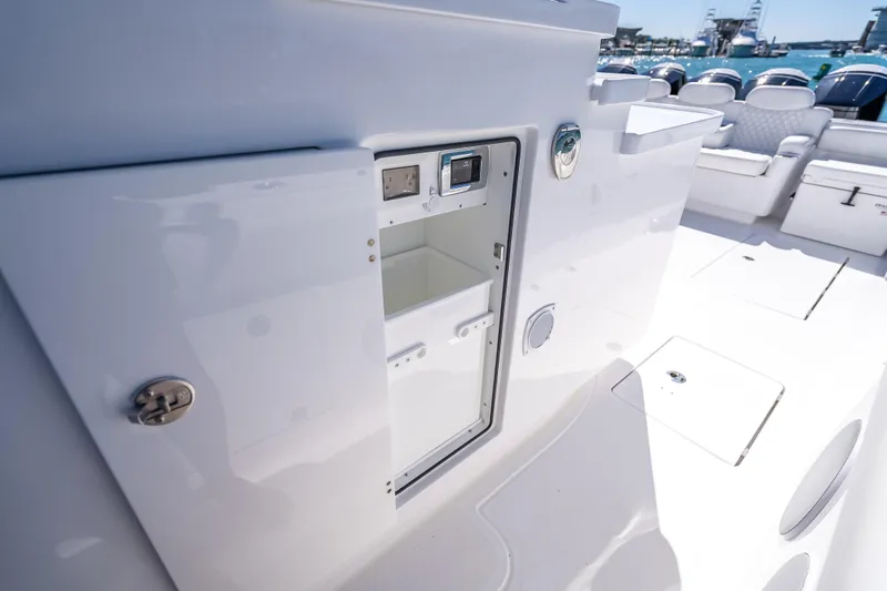 Slide: The Image of Open storage compartment on 2026 HCB 65 Estrella boat, showcasing sleek interior design. - 40