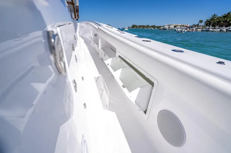 Slide: The Image of 2026 HCB 65 Estrella boat deck with sleek white design and ocean view. - 41