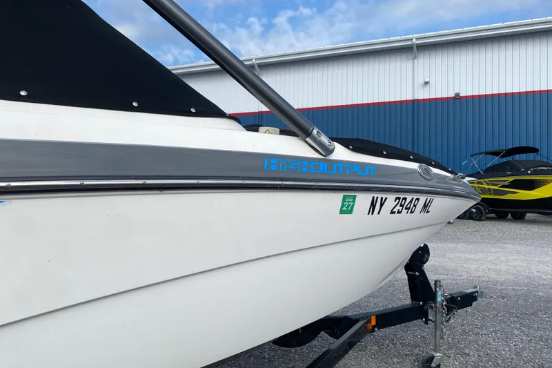 Slide: The Image of 2015 Yamaha Boats 212X on trailer, high output model, parked outdoors. - 10