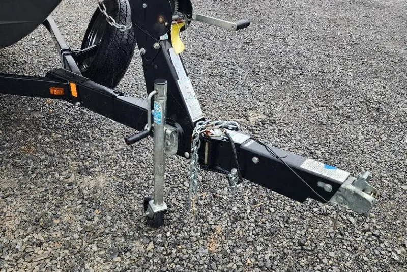 Slide: The Image of Trailer hitch of a 2015 Yamaha Boats 212X on gravel surface. - 12