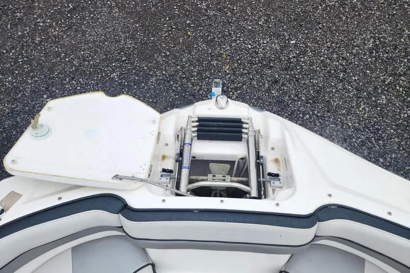 Slide: The Image of 2015 Yamaha Boats 212X bow area with open anchor compartment. - 13