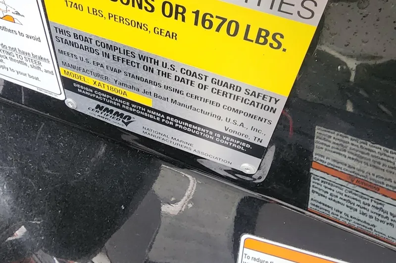Slide: The Image of 2015 Yamaha Boats 212X compliance label, U.S. Coast Guard safety standards, model XAT1800A. - 26