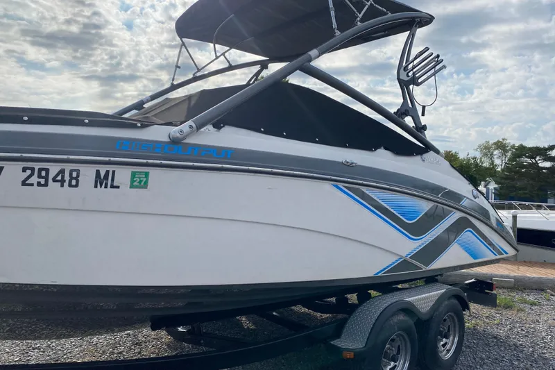 Slide: The Image of 2015 Yamaha Boats 212X on trailer, featuring sleek design and high output graphics. - 3