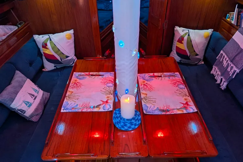 Slide: The Image of Cozy 1982 Shannon Pilothouse interior with nautical-themed decor and ambient lighting. - 10