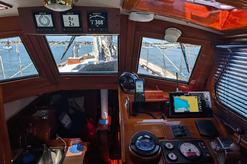 Slide: The Image of 1982 Shannon Pilothouse interior with navigation instruments and sea view. - 2