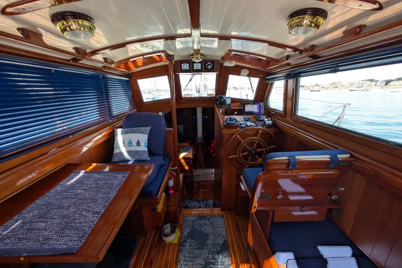 Slide: The Image of 1982 Shannon Pilothouse interior with wooden finish, nautical decor, and steering wheel. - 5