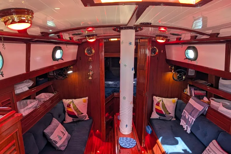 Slide: The Image of Cozy 1982 Shannon Pilothouse interior with nautical decor and warm lighting. - 9