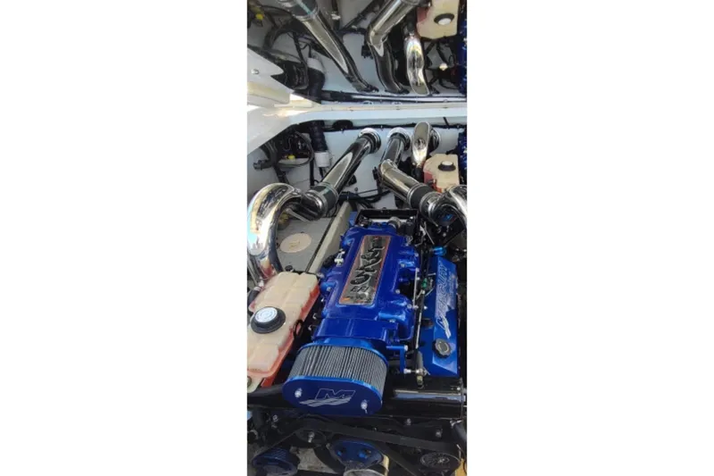 Slide: The Image of Engine compartment of a 2007 Donzi 38 ZR boat, featuring a high-performance engine. - 12