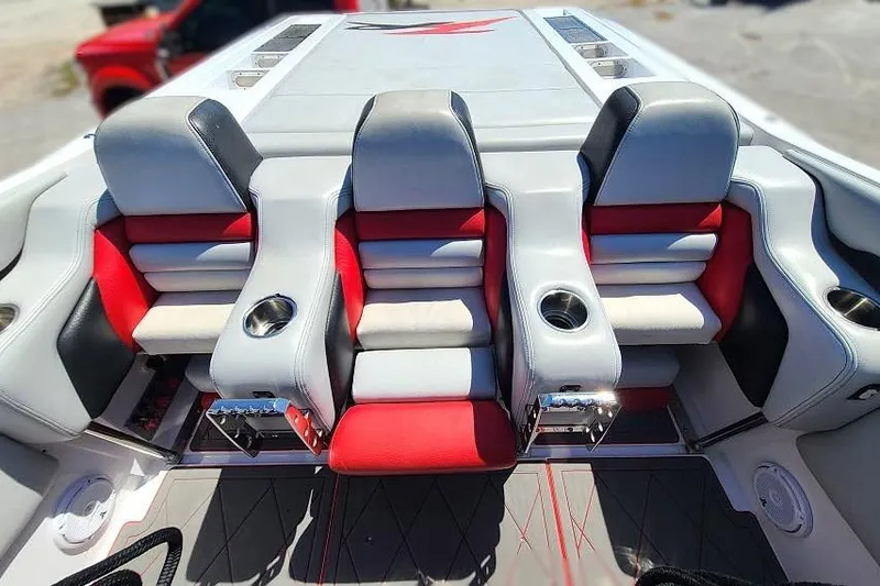 Slide: The Image of 2007 Donzi 38 ZR boat interior with red and gray seating, cup holders, and sleek design. - 5