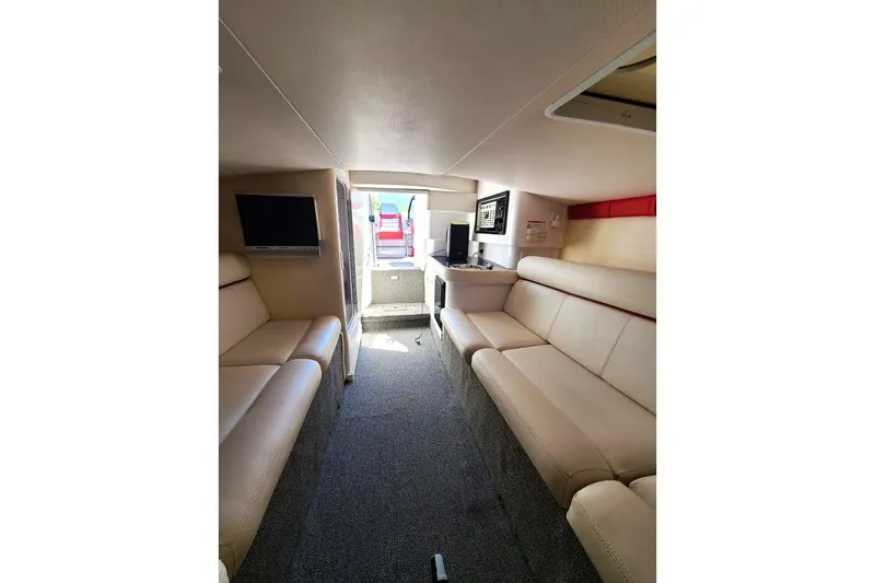Slide: The Image of Interior of 2007 Donzi 38 ZR boat with beige seating and modern amenities. - 7