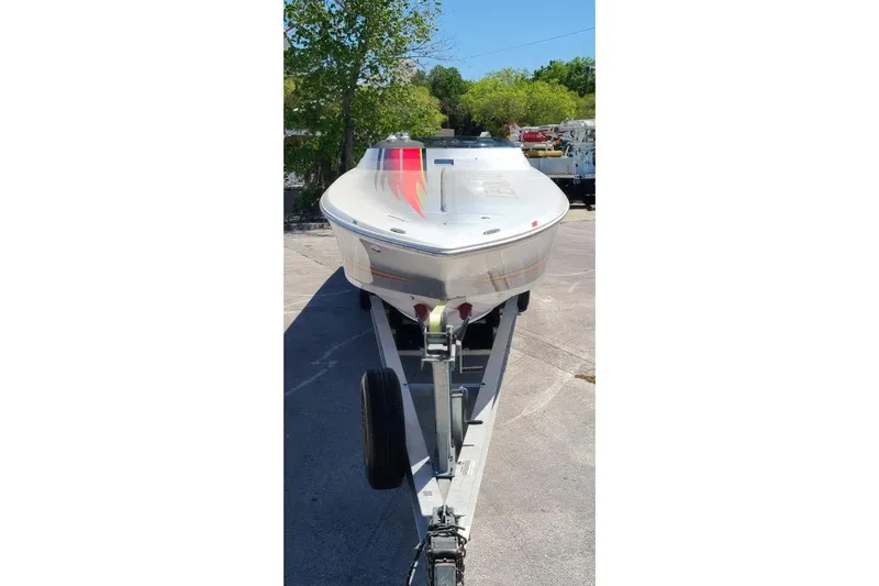 Slide: The Image of 2007 Donzi 38 ZR speedboat on trailer, parked outdoors, front view. - 9