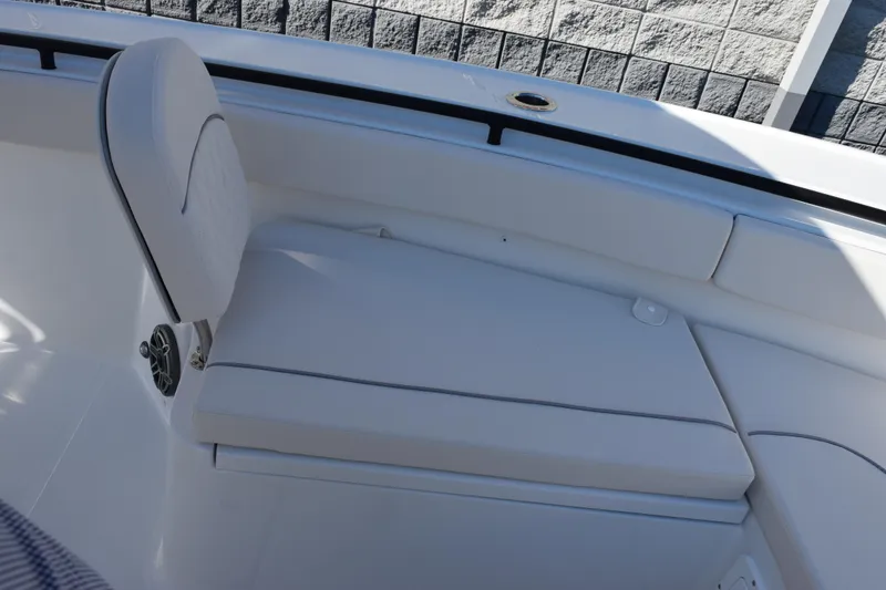 Slide: The Image of 2026 Sea Hunt Ultra 275 SE boat seating with white cushioned upholstery. - 15