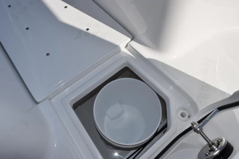 Slide: The Image of Interior view of 2026 Sea Hunt Ultra 275 SE boat with storage compartment. - 16