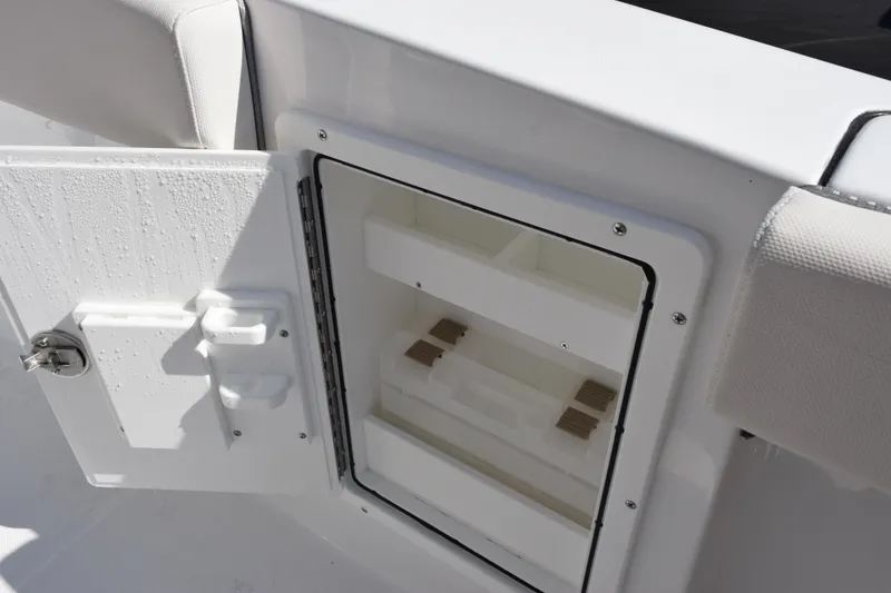 Slide: The Image of Open storage compartment on 2026 Sea Hunt Ultra 275 SE boat. - 21