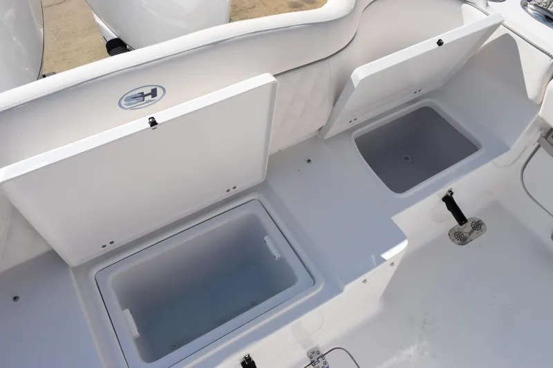 Slide: The Image of 2026 Sea Hunt Ultra 275 SE boat storage compartments, open and ready for use. - 23