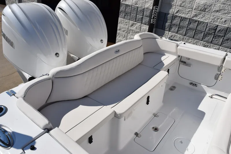 Slide: The Image of 2026 Sea Hunt Ultra 275 SE boat interior with dual Yamaha engines and white seating. - 7