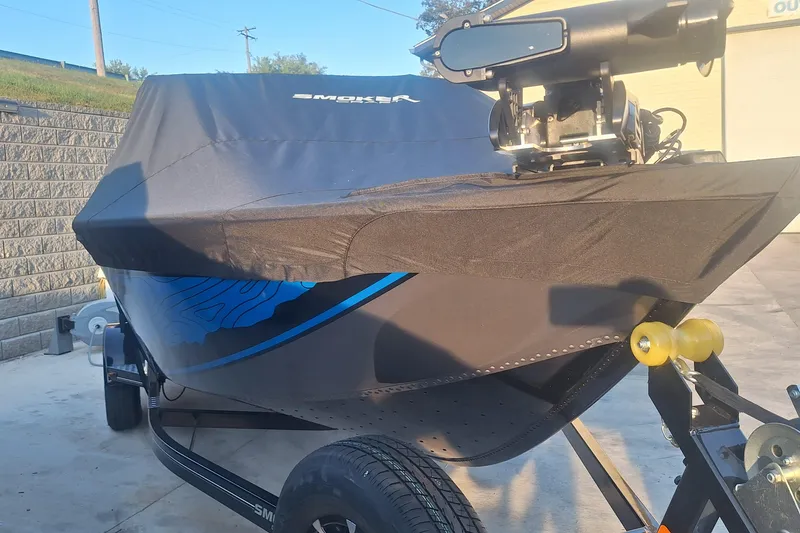 Slide: The Image of 2026 Smoker Craft Adventurer 188 DC boat with cover on trailer. - 4