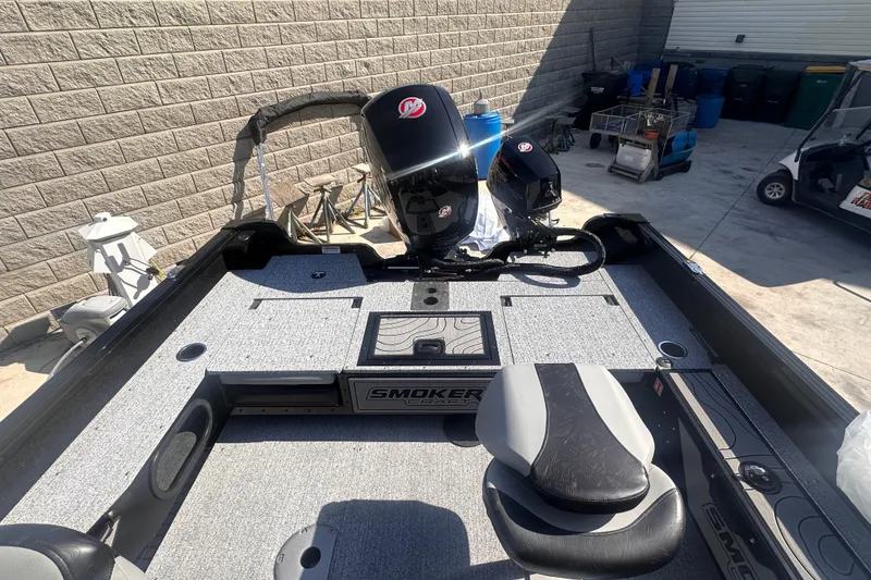 Slide: The Image of 2026 Smoker Craft Adventurer 188 DC boat, featuring dual motors and spacious deck layout. - 5