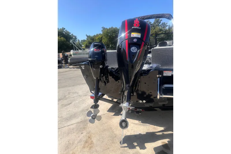 Slide: The Image of 2026 Smoker Craft Adventurer 188 DC boat with dual outboard motors. - 9